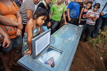Investigating CKDnT Nicaragua 2013 – 2023***NO NAMES TO BE USED***Family and friends gather for the funeral procession and burial of a former sugar cane worker, 36, who died of Chronic Kidney Disease of unknown origin (CKDu), after working in the sugar cane fields for 12 years in Chichigalpa, Nicaragua on Jan. 7, 2013. He is part of a steady procession of deaths among the cane workers in Chichigalpa, Nicaragua.
