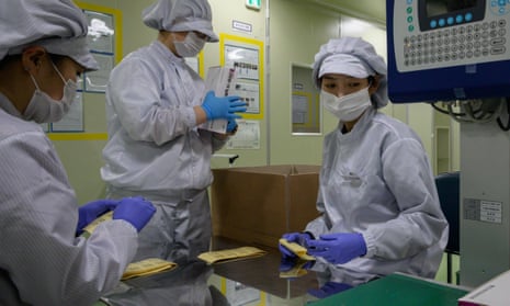 COVID-19 novel coronavirus testing kits are packaged on a production line at the SD Biosensor bio-diagnostic company near Cheongju, South Korea.