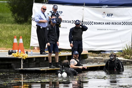 Police divers prepare to search an area at Yerrabi pond where two bodies were discovered