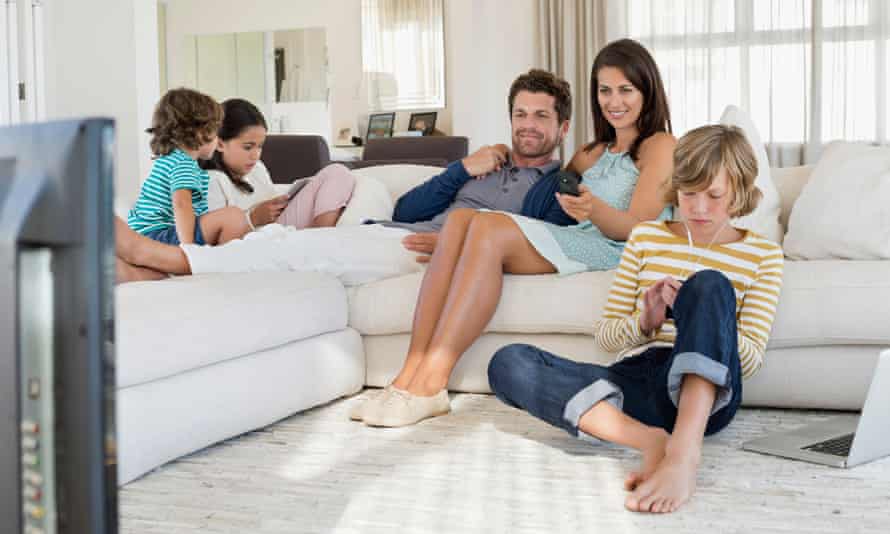 Family using electronic gadgets.