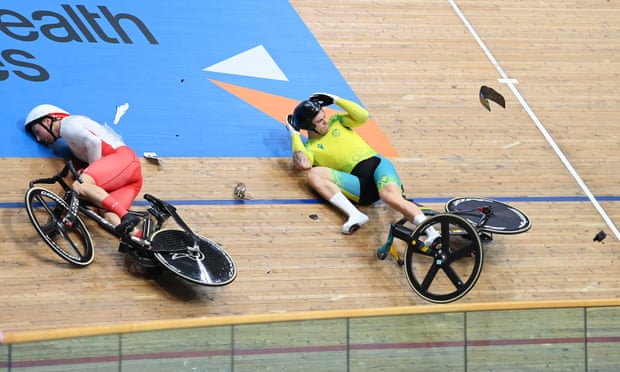 England’s Joe Truman (left) and Matthew Glaetzer of Australia (right) are left on the track after a crash in the Keirin on Saturday.