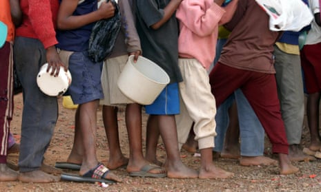 Aids orphans queue for food at a kindergarten in Manzini, Swaziland