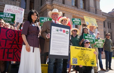 People stand outside the Texas capitol to protest datacenters