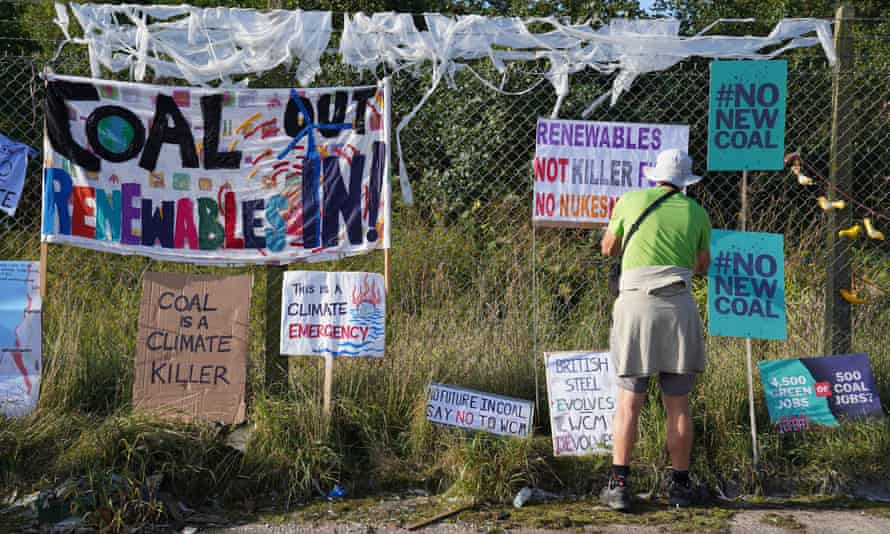A protester outside the proposed site of Woodhouse Colliery, south of Whitehaven in Cumbria