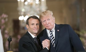 ‘Arm wrestle, Frenchie? You know there’s only one winner’ … Macron and Trump.