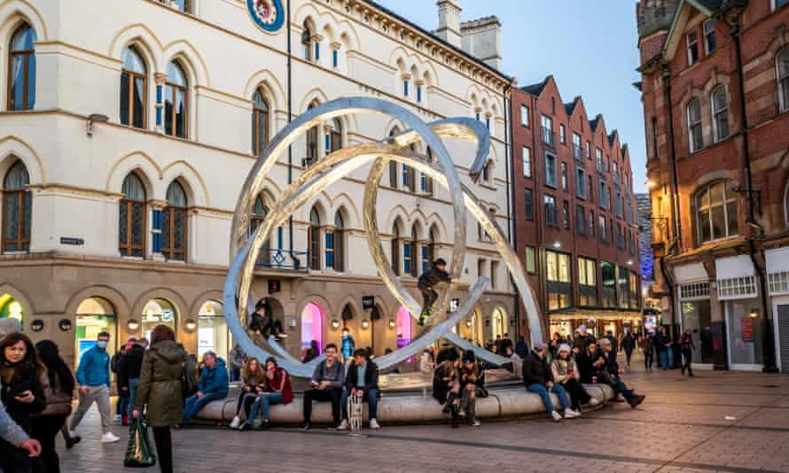 Arthur Square Belfast. People sit by fountain in city centre