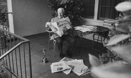 Chaplin reading the papers the morning after his Academy Award win for Limelight, in 1972.