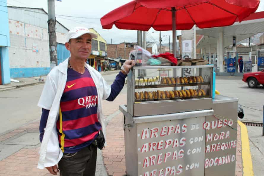 ‘It’s the place for people with nothing’ … Javier Duque selling arepas in the district of Ciudad Bolívar.