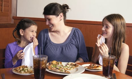 Mother and daughters at restaurant