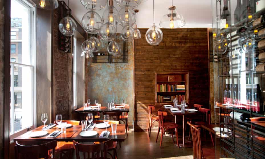 The Ninth restaurant with hanging glass lights and bare brick walls