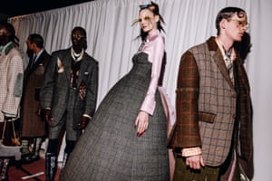 Models backstage in tweed outfits