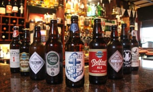 Bottled beers lined up on the bar at The John Hewitt pub in Belfast, Northern Ireland.