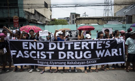 Protesters at a funeral march for the 17-year-old student Kian Delos Santos.