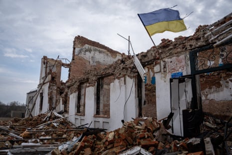 A Ukrainian flag on the wall of a destroyed school in Senkove village in Luhansk oblast.
