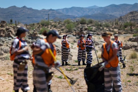 An all-female chain gang works in 40C heat in Arizona.