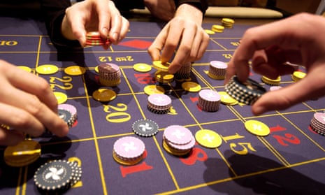 Punters place bets on a roulette table.