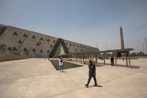 visitors walk outside the Grand Egyptian Museum