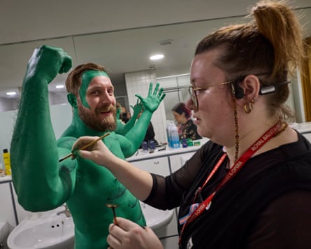 Actor and stuntman James Unsworth has his body painted green in preparation for his role as the executioner.