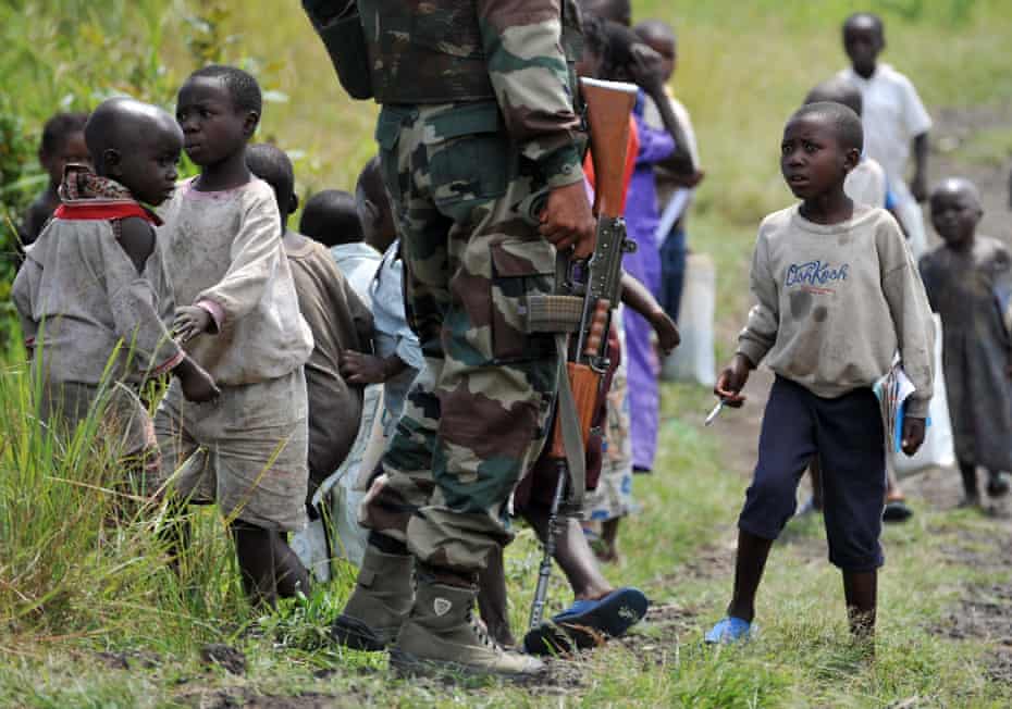 A UN soldier patrolling a camp for internally displaced people in Goma, in the Democratic Republic of the Congo.