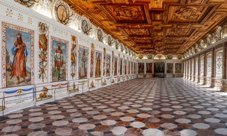 long gallery with coffered ceiling and paintings