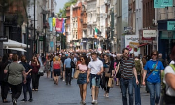 Crowds of shoppers on a street in Dublin, Ireland.
