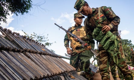 This photo taken on November 9, 2024 shows members of Ta’ang National Liberation Army (TNLA) receiving military equipments at a graduation ceremony after getting special combat training for three months in a secret jungle near Namhkam, Myanmar’s northern Shan State. The Ta’ang National Liberation Army has battled with the Myanmar military for years and has launched the “Operation 1027” in 2023 -- named after its starting date. The operation has ejected the junta from around 50,000 square kilometres according to analysts and an AFP tally.