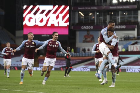 Aston Villa’s Ollie Watkins, right, celebrates after scoring his side’s fourth goal.