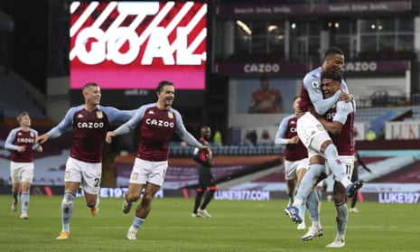 Aston Villa’s Ollie Watkins, right, celebrates after scoring his side’s fourth goal.