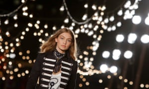 Model Gigi Hadid presents a creation from Tommy Hilfiger’s new collection at New York Fashion Week.
