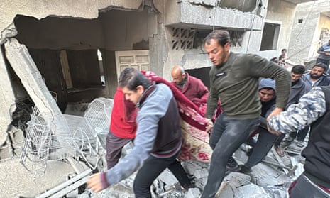 Civil defence teams and local residents conduct a search and rescue operations in Jabalia after the Israeli attacks