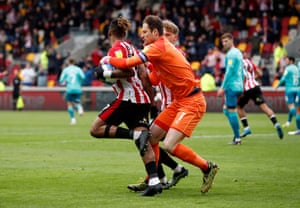 Bournemouth’s keeper Asmir Begovic clashes with Brentford’s Ivan Toney after Toney scored their first goal from the penalty spot.