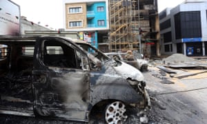 Charred vehicles in Tripoli, following exchanges of rocket and artillery fire in the capital