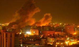 An explosion rocks a residential neighborhood of Baghdad during the Iraq invasion.