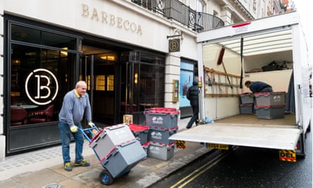 Removal men take away stock from Jamie Oliver’s Barbecoa restaurant in Piccadilly.