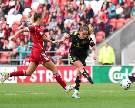 Ella Toone (right) holds off Gemma Evans to score Manchester United’s second goal.