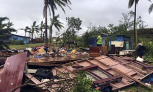 A family digs through the remains of their home in the town of Ba, after it was destroyed by cyclone Winston, the only category five storm system to ever hit Fiji.