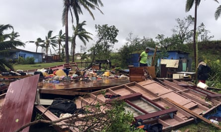 A family digs through the remains of their home in the town of Ba, after it was destroyed by cyclone Winston, the only category five storm system to ever hit Fiji.