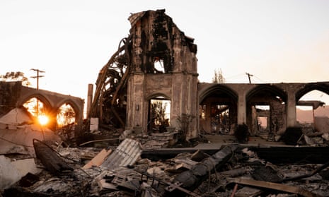 Sun sets behind the remains of a church destroyed by the Palisades Fire in the Pacific Palisades neighborhood in Los Angeles, California, U.S. January 11, 2025. REUTERS/David Ryder