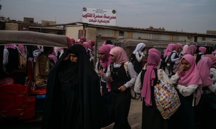 Schoolgirls finishing their classes in the outskirts of Sadr City.