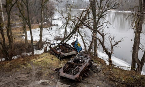 Destroyed armoured vehicles sit on the bank of the Siverskiy-Donets river in Bogorodychne, Ukraine