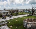 Residents of Codrington and Red Cross workers survey damage on the island of Barbuda in the aftermath of Hurricane Irma