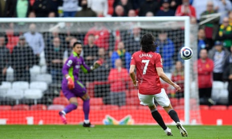 Manchester United’s Uruguayan striker Edinson Cavani scores the opening goal.