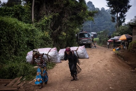 Women carry bags of charcoal in a village near Kahuzi-Biega national park