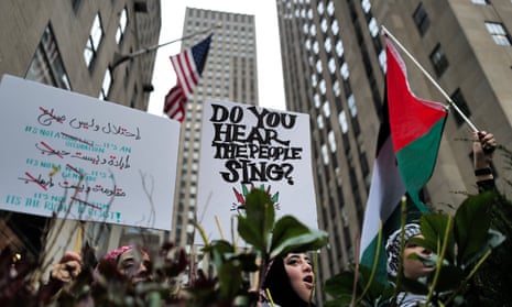 Protestors wave flags and placards as demonstrators protest in support of Palestinians in New York on December 25. Thousands of civilians, both Palestinians and Israelis, have died since October 7, after Palestinian Hamas militants based in the Gaza Strip entered southern Israel in an unprecedented attack.