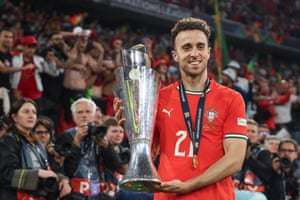 Diogo Jota poses with the trophy after Portugal defeated Spain in the 2025 Nations League final
