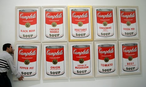 A worker hangs a print of Andy Warhol’s Campbell’s soup at a museum in Palma de Mallorca. The Andy Warhol Foundation closed its authentication board following a costly lawsuit.