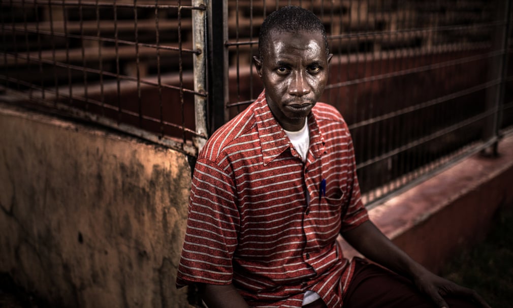 Mamadou Saliou Diallo was photographed at the exit to the stadium where he was almost crushed to death. ‘I was in the stands when they started shooting. Then the person in front of me was shot in the shoulder so I knew it was real.'