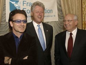 Former US president Bill Clinton (centre) shares a laugh with former Mikhail Gorbachev and U2 frontman Bono before a dinner at the Russian embassy in New York in honour of Frank Foundation Child Assistance International on 10 March 2002.
