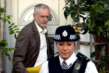 Jeremy Corbyn leaves his house with a police officer escort