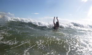 Morgan Tilly takes a dip in the ocean at Semaphore in Adelaide.